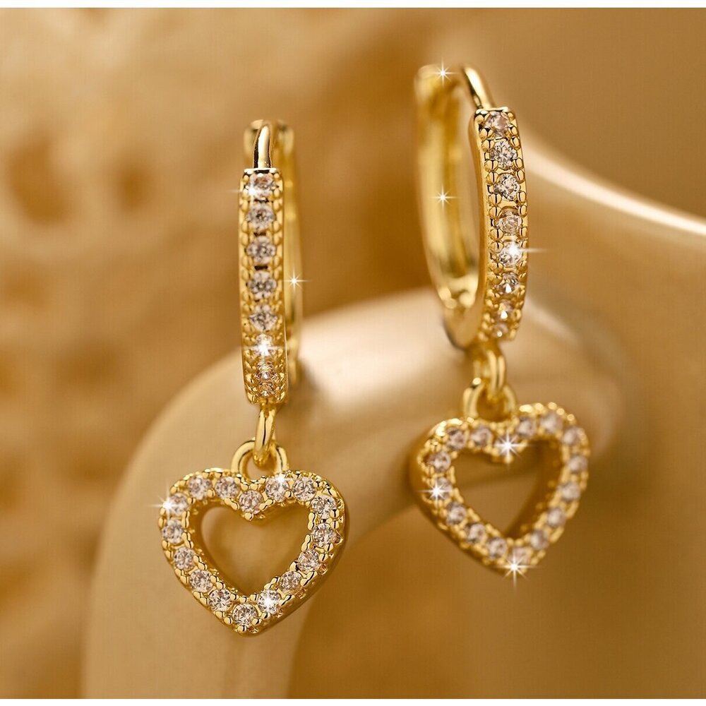 Hollow-out crescent hoop earrings with a slim U-shaped drop.